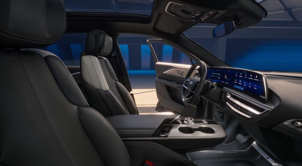 The black interior of a 2024 Cadillac LYRIQ is shown from the passenger side front seat.