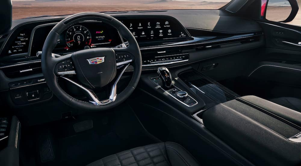 The black interior cabin of a 2024 Cadillac Escalade IQ.