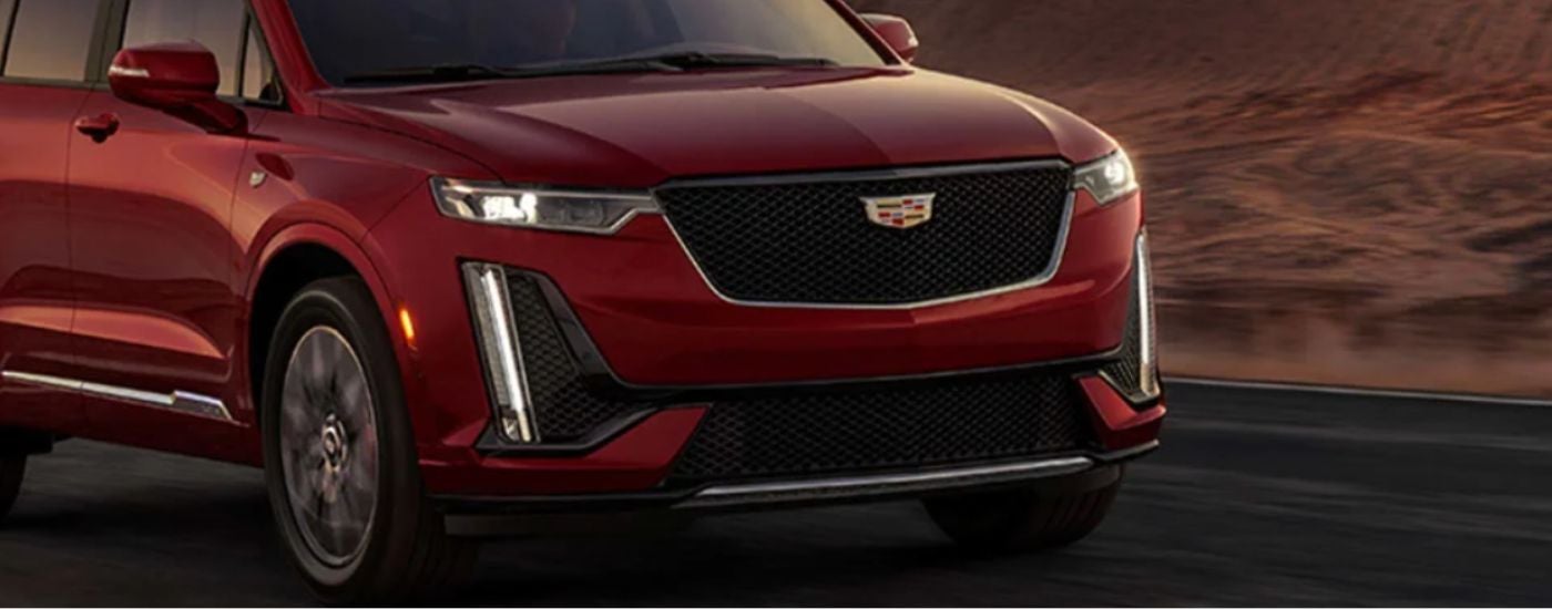 Close-up of the front grille on a red 2025 Cadillac XT6.