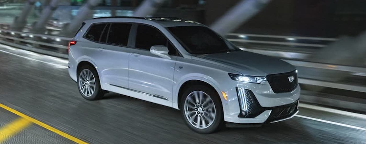 A white 2021 Cadillac XT6 is shown from the front at an angle.