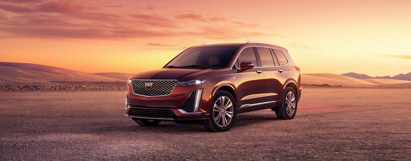A red 2023 Cadillac XT6 for sale is shown from the front at an angle.