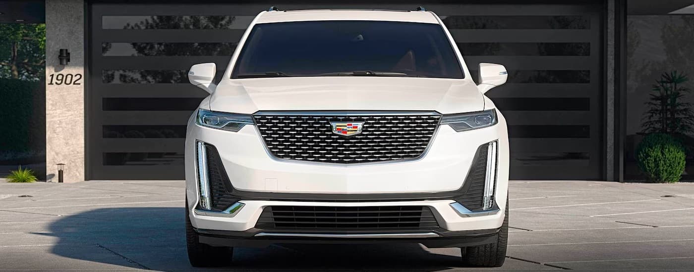 Front of a white 2024 Cadillac XT6 parked on a driveway.