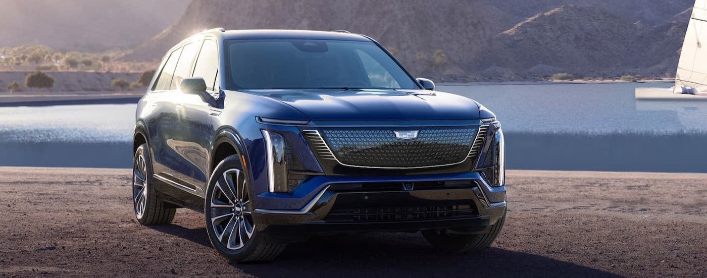 A blue 2026 Cadillac VISTIQ for sale parked on a sunny day.