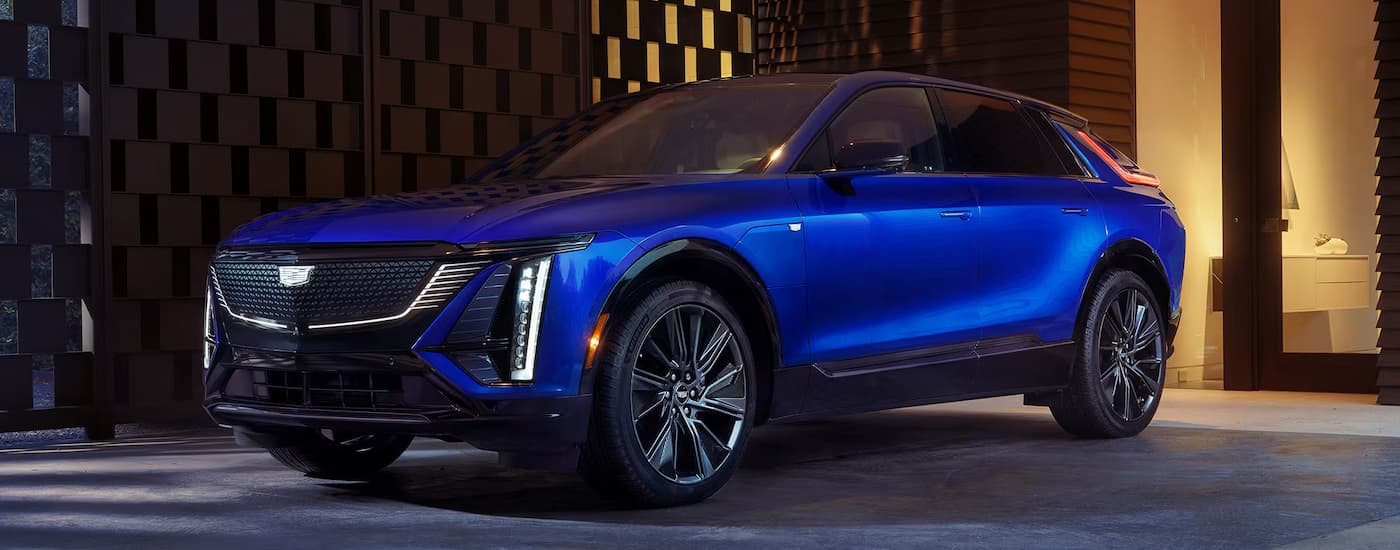 Blue 2027 Cadillac LYRIQ parked on a driveway.