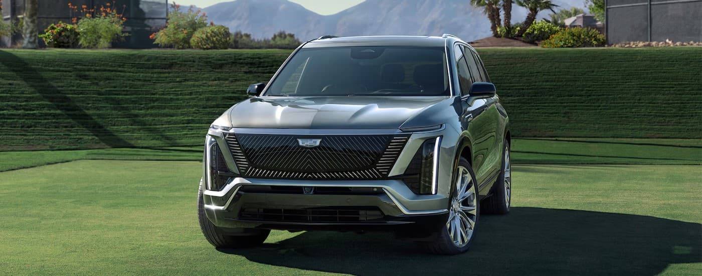 A silver 2026 Cadillac VISTIQ for sale parked on grass.