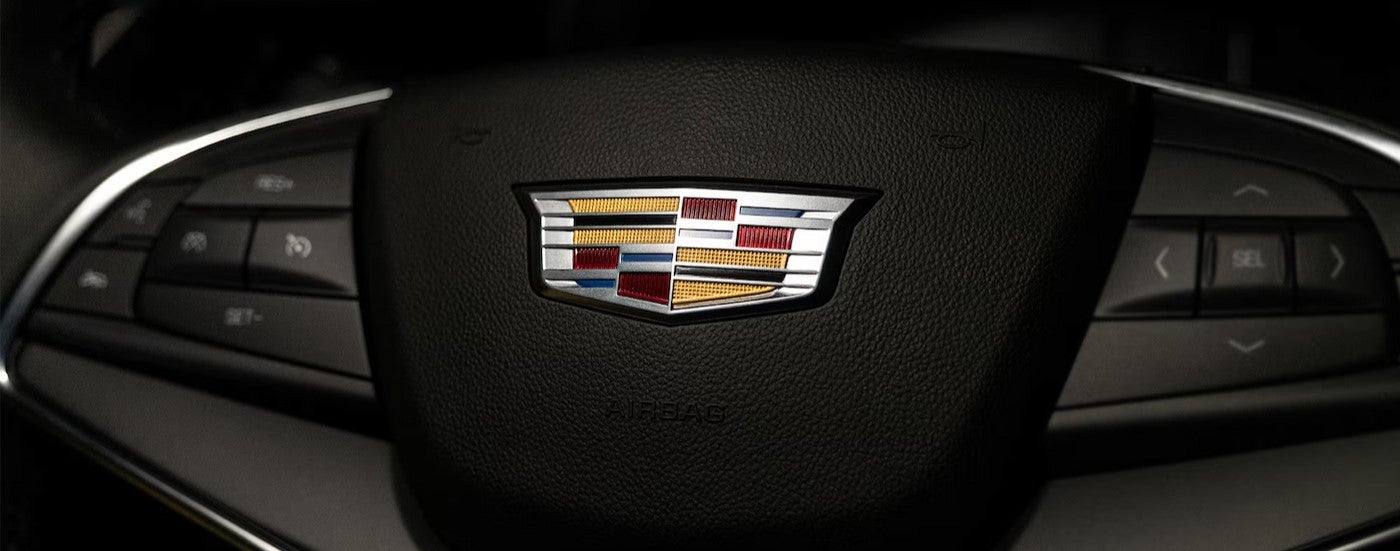 Close-up of the steering wheel in a 2025 Cadillac XT5.