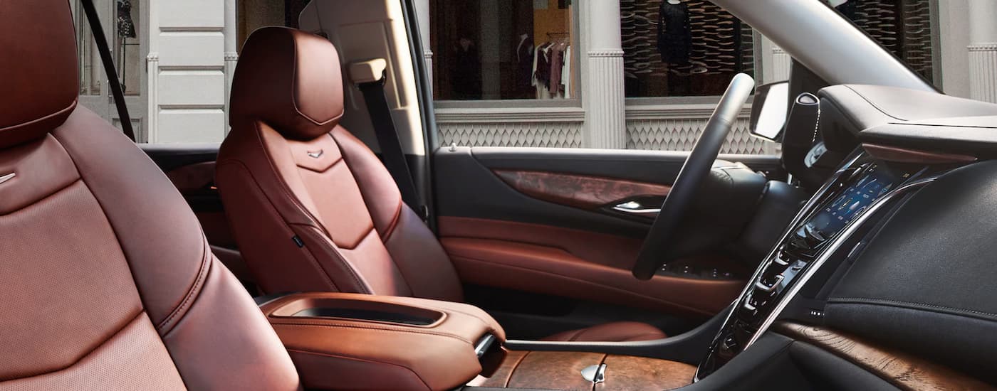 The brown leather interior of a 2020 Cadillac Escalade at a used Cadillac dealer.
