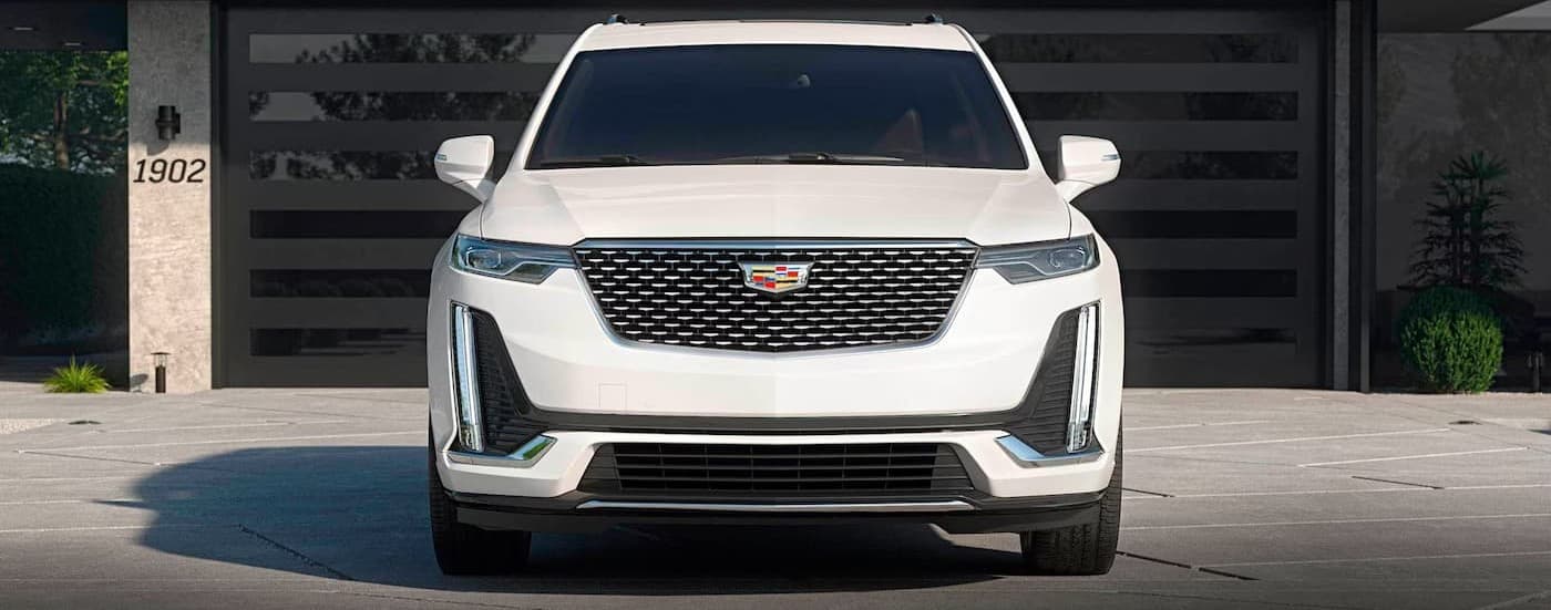 A white 2025 cadillac XT6 parked on a driveway.
