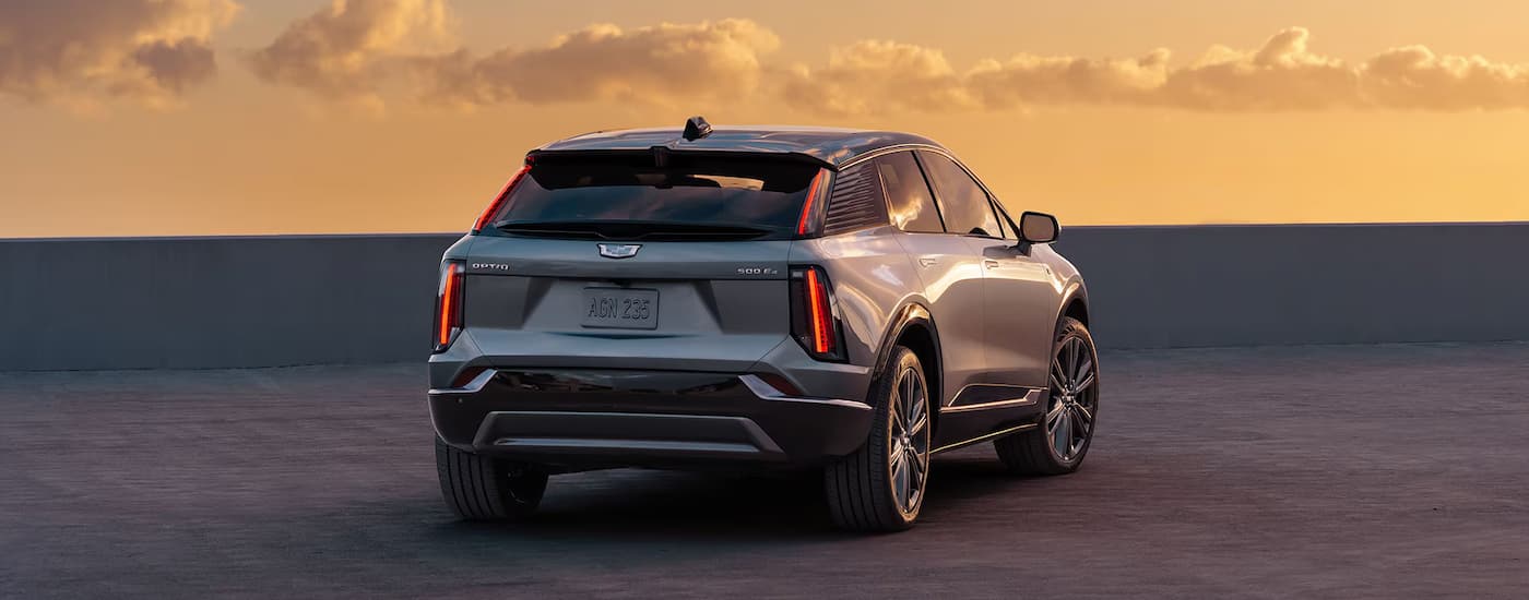 A silver 2025 Cadillac OPTIQ parked off-road