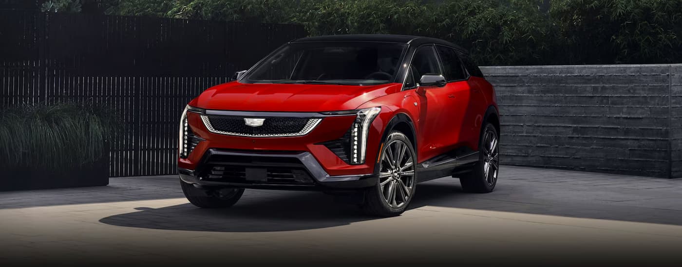 A red 2026 Cadillac OPTIQ parked for sale near me